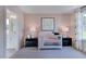 Bedroom with crib, chair, and charming decor at 109 Magma Ln, Holly Springs, NC 27540