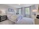 Spacious bedroom with a plush bed and soft color scheme at 109 Magma Ln, Holly Springs, NC 27540