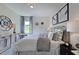 Bright bedroom with king-size bed and stylish decor at 109 Magma Ln, Holly Springs, NC 27540