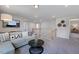 Open bonus room with a sectional sofa and plenty of natural light at 109 Magma Ln, Holly Springs, NC 27540