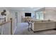 Spacious bonus room with a comfortable couch and large TV at 109 Magma Ln, Holly Springs, NC 27540