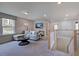 Bright bonus room with a comfortable couch and plenty of space at 109 Magma Ln, Holly Springs, NC 27540