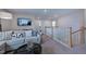 Comfortable bonus room with a cozy couch and tv at 109 Magma Ln, Holly Springs, NC 27540