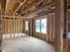 New home construction features an open floor plan with large windows at 109 Magma Ln, Holly Springs, NC 27540