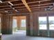New home construction features an open floor plan with large windows at 109 Magma Ln, Holly Springs, NC 27540