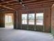 New home construction features an open floor plan with large windows at 109 Magma Ln, Holly Springs, NC 27540