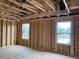 New home construction features an open floor plan with large windows at 109 Magma Ln, Holly Springs, NC 27540