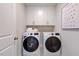 Well-lit laundry room with washer and dryer at 109 Magma Ln, Holly Springs, NC 27540