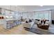 Spacious living room with hardwood floors and large windows at 109 Magma Ln, Holly Springs, NC 27540