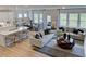 Open concept living area with hardwood floors and natural light at 109 Magma Ln, Holly Springs, NC 27540