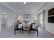 Bright main bedroom with a king-size bed and sitting area at 109 Magma Ln, Holly Springs, NC 27540