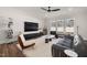 Cozy living room featuring a large TV and comfortable seating at 120 Rider Race Bnd, Holly Springs, NC 27540