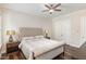 Cozy bedroom with a tufted headboard and hardwood floors at 123 Stone Park Dr, Wake Forest, NC 27587