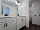 Bathroom with double vanity, sleek fixtures, and a doorway to the toilet and shower at 137 Pretty Run Branch Ln, Wendell, NC 27591