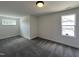 Bright bedroom with neutral walls, soft carpet, and natural light from the double windows at 137 Pretty Run Branch Ln, Wendell, NC 27591