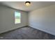 A carpeted bedroom features natural light from a window and neutral walls at 137 Pretty Run Branch Ln, Wendell, NC 27591