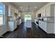 Modern kitchen with white cabinets, stainless steel appliances, granite countertops, and a kitchen island at 137 Pretty Run Branch Ln, Wendell, NC 27591