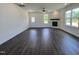 Spacious living room with a ceiling fan, fireplace, and large windows providing ample natural light at 137 Pretty Run Branch Ln, Wendell, NC 27591