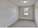 Simple bedroom with carpeted floor, window, and neutral walls at 15 Michael Ct, Erwin, NC 28339