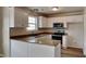 Modern kitchen with granite countertops and white cabinets at 15 Michael Ct, Erwin, NC 28339