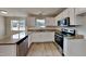Modern kitchen with granite countertops and white cabinets at 15 Michael Ct, Erwin, NC 28339