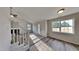 Living room with stairs, carpet, and large window at 15 Michael Ct, Erwin, NC 28339