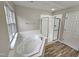 Bathroom features a soaking tub and a separate shower at 1527 Haywards Heath Ln, Apex, NC 27502