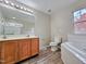 Main bathroom with double vanity and garden tub at 1527 Haywards Heath Ln, Apex, NC 27502