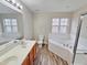 Bathroom boasts a double vanity, soaking tub, and shower at 1527 Haywards Heath Ln, Apex, NC 27502