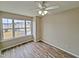 Well-lit bedroom with hardwood floors and a window seat at 1527 Haywards Heath Ln, Apex, NC 27502