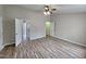 Spacious bedroom with hardwood floors and access to another bedroom at 1527 Haywards Heath Ln, Apex, NC 27502