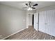 Spacious bedroom with double doors and wood floors at 1527 Haywards Heath Ln, Apex, NC 27502