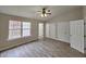 Large bedroom with hardwood floors and ample closet space at 1527 Haywards Heath Ln, Apex, NC 27502