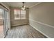 Bright dining area with hardwood floors and access to deck at 1527 Haywards Heath Ln, Apex, NC 27502