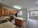 Eat-in kitchen with island, stainless steel appliances, and ample cabinet space at 1527 Haywards Heath Ln, Apex, NC 27502