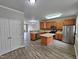 Open kitchen with island and stainless steel appliances at 1527 Haywards Heath Ln, Apex, NC 27502