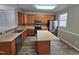 Modern kitchen with stainless steel appliances and an island at 1527 Haywards Heath Ln, Apex, NC 27502