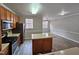 Kitchen with island, stainless steel appliances, and wood cabinets at 1527 Haywards Heath Ln, Apex, NC 27502