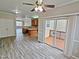 Spacious living room with hardwood floors and access to a deck at 1527 Haywards Heath Ln, Apex, NC 27502