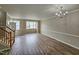 Spacious living room with hardwood floors and a chandelier at 1527 Haywards Heath Ln, Apex, NC 27502