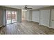 Spacious living room with laminate flooring and access to a patio at 1527 Haywards Heath Ln, Apex, NC 27502