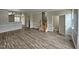 Open living room with hardwood floors and access to kitchen at 1527 Haywards Heath Ln, Apex, NC 27502