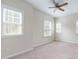 Spacious bedroom with multiple windows and ceiling fan at 2024 Chipley Dr, Cary, NC 27519