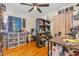 Bright bedroom with hardwood floors, ceiling fan, and ample storage at 2505 Friendly Trl, Raleigh, NC 27610