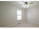 Bright bedroom with ceiling fan and light hardwood floors at 2615 Barwick Dr, Durham, NC 27704