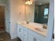 Bathroom with double sinks, quartz counters, modern fixtures and a walk-in shower at 292 Weddington Way, Benson, NC 27504