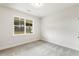 Cozy bedroom with soft carpet and a large window offering a serene view at 292 Weddington Way, Benson, NC 27504