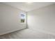 Bright bedroom featuring neutral carpet, base trim and a view through the window at 292 Weddington Way, Benson, NC 27504
