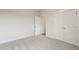 Bedroom featuring neutral walls and carpet, plus a large double door closet at 292 Weddington Way, Benson, NC 27504