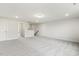 Open bonus room with neutral walls, plush carpet, and ample natural light at 292 Weddington Way, Benson, NC 27504